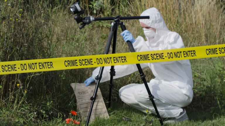 A man in a hazmat suit for an investigation.